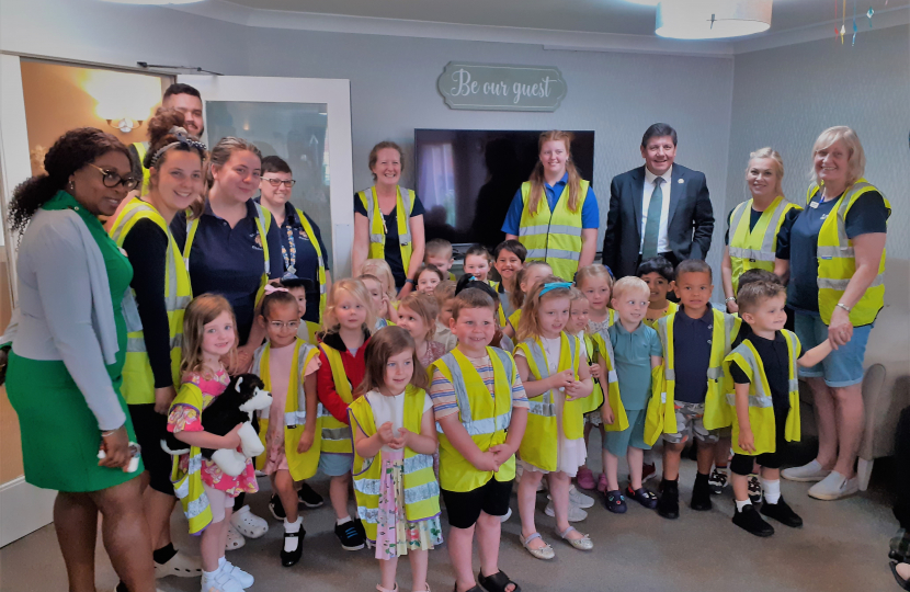 Stephen Metcalfe with Oaklands Care Home staff and children from St John's Childcare.