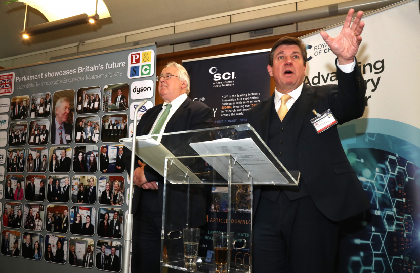 Stephen exclaims at the podium with Stephen Benn, President of the Parliamentary and Scientific Committee and member of the House of Lords.