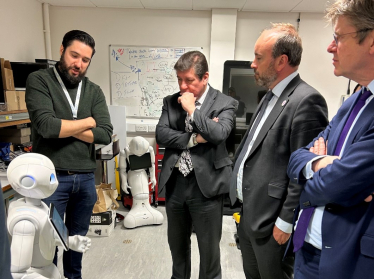 Stephen Metcalfe, Aaron Bell and Greg Clark from the Science, Innovation and Technology Committee are given a tour of the Institute for People-Centred AI.