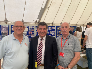 Stephen meets with Mike Tarbard and John Purkiss in front of the heritage section.